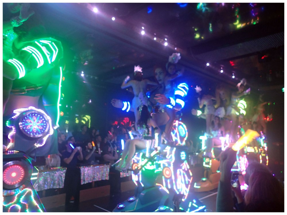 Sexy ladies hanging out on giants robots